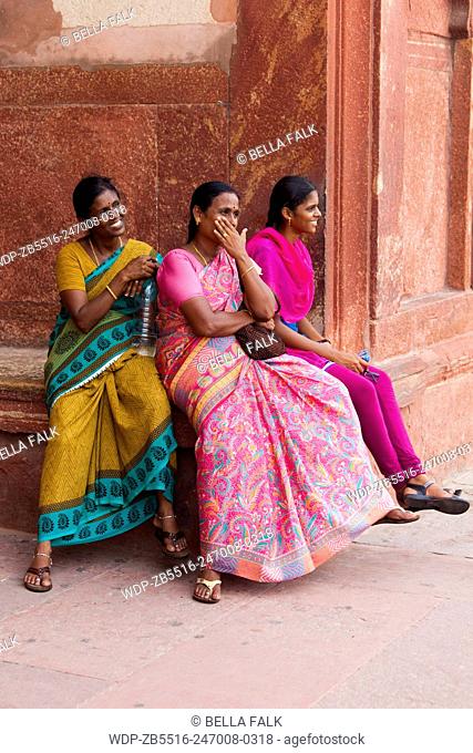 Three Indian women relax at the Red Fort, Agra, Uttar Pradesh, India