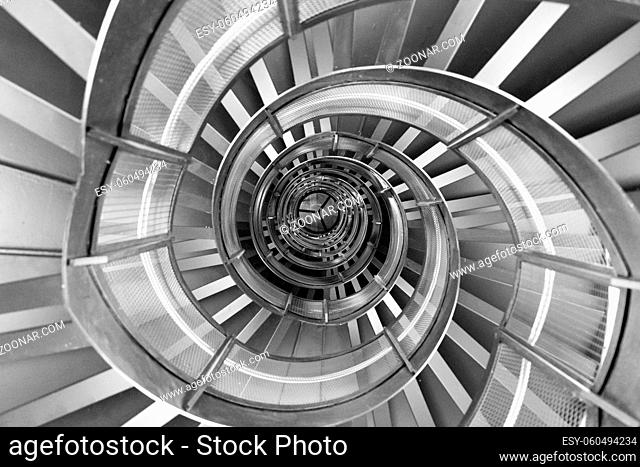 Innsbruck, Austria - June 8, 2018: View of the spiral staircase inside the historic Town Tower in black and white