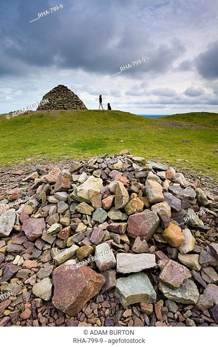 Stone cairns and dogwalker at Dunkery Beacon in Exmoor National Park, Somerset, England, United Kingdom, Europe