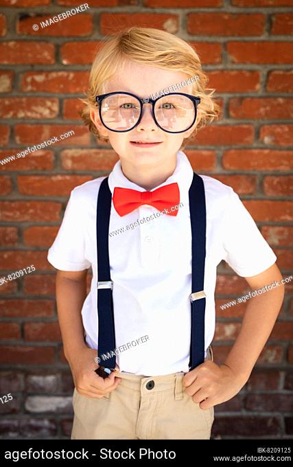 Cute young caucasian boy wearing glasses and red, white and blue