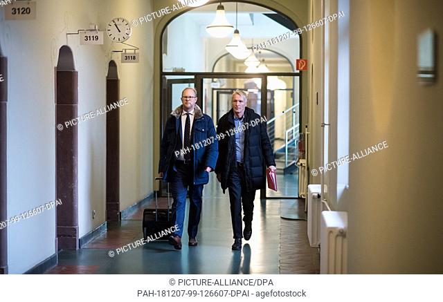 07 December 2018, Berlin: Hubertus Knabe (r), former director of the Hohenschönhausen memorial, comes together with his lawyer Martin Römermann to the hearing...