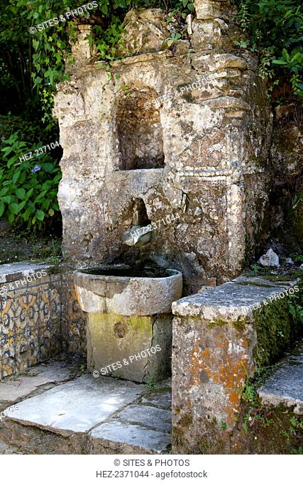 A fountain in Capuchos Convent, Sintra, Portugal, 2009. Founded in 1560 by the son of the governor of India, this convent is located on a hilltop and was carved...