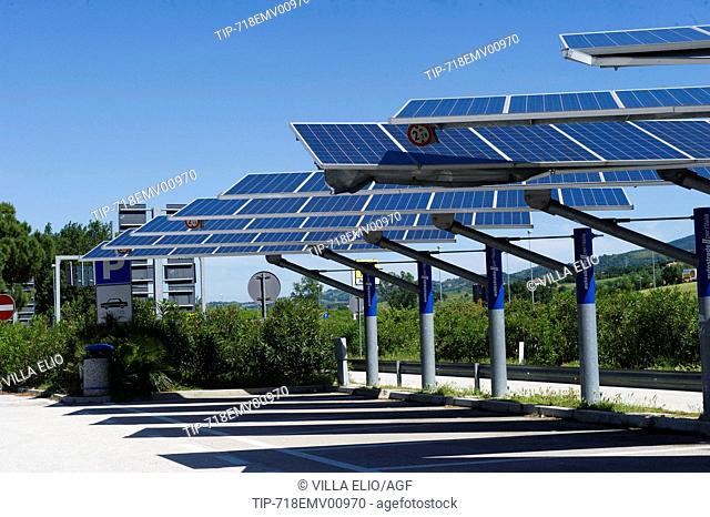 Installed solar panels on the areas of parking lot of the Italian highways