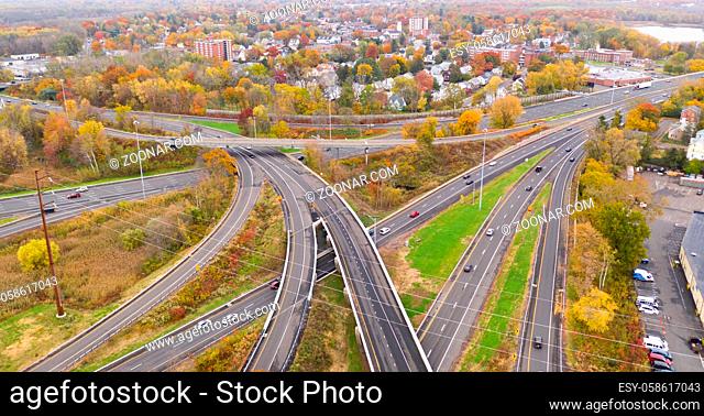 Fall color fills the tress around the urban landscape of East Hartford Connecticut in New England