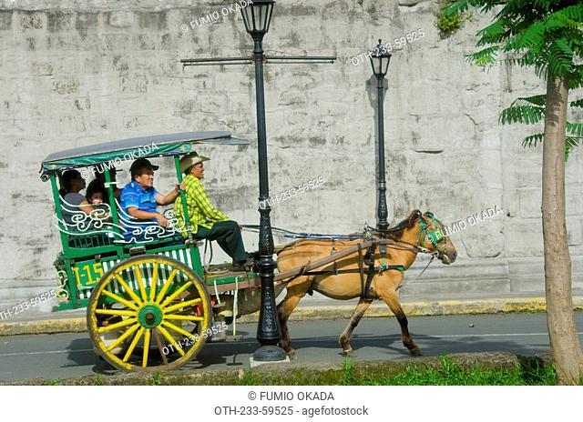 Tourists touring on carriage at Intramuros, Manila, Philippines