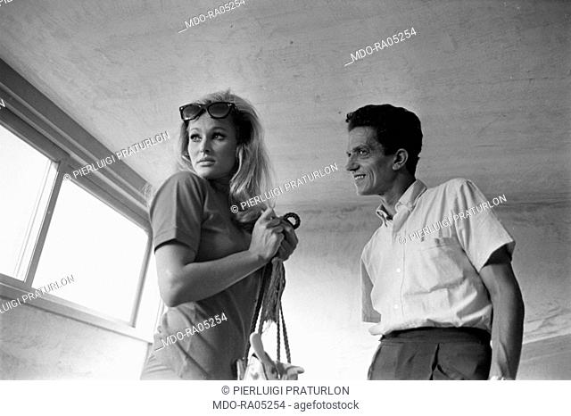 Italian photographer Pierluigi Praturlon and Swiss actress Ursula Andress talking on the set of The 10th Victim. 1965