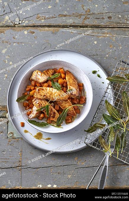Spicy salmon fillet strips with soy carrots and fried sage leaves