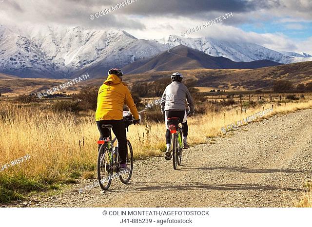 Cyclists on Otago Rail Trail near Oturehua, Central Otago, New Zealand