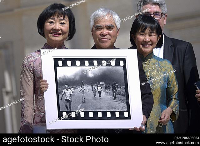 Photographer Nick Ut poses with his 1972 picture “The Terror of War”, also known as the ""Napalm Girl"", next to a woman (L) featured in the picture as a child