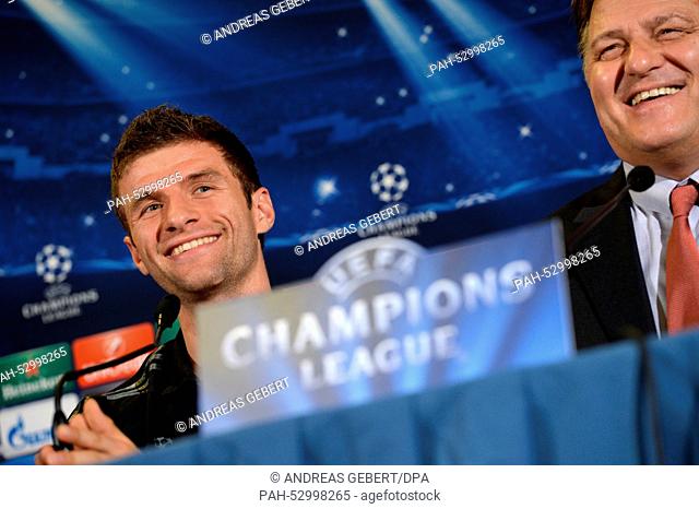 Munich's Thomas Mueller (L) director of media Markus Hoerwick smile during a press conference at the team hotel in Rome, Italy