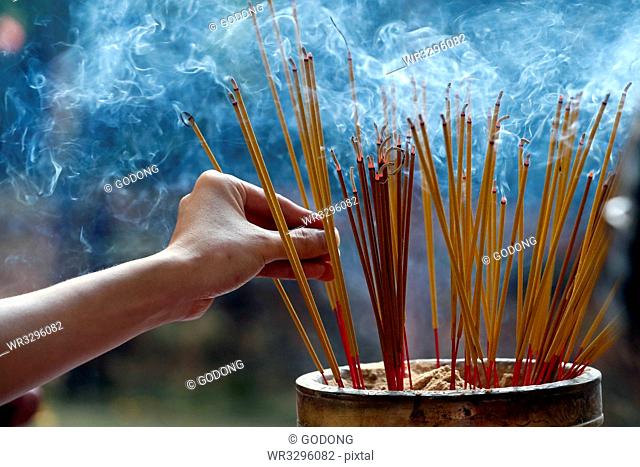 Emperor Jade pagoda (Chua Phuoc Hai), incense sticks on joss stick pot burning, smoke used to pay respect to the Buddha, Ho Chi Minh City, Vietnam, Indochina