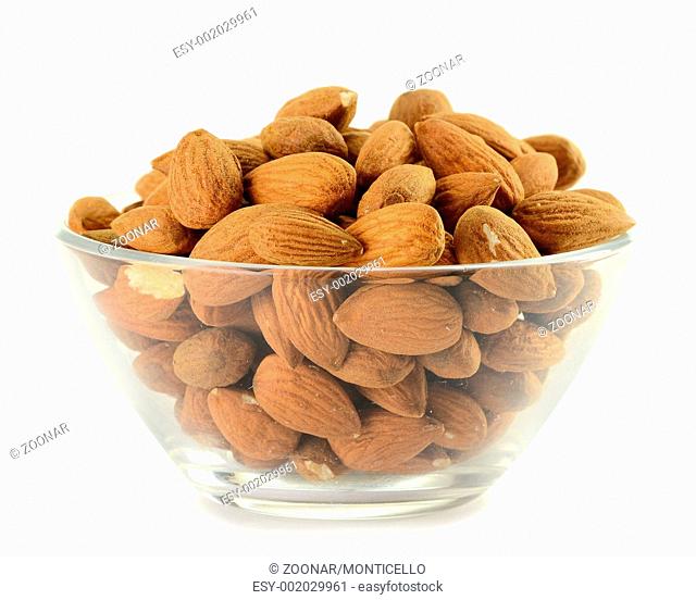 Small kitchen dish with almonds isolated on white