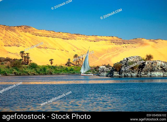 Beautiful landscape with felucca boat on Nile river near Aswan, Egypt