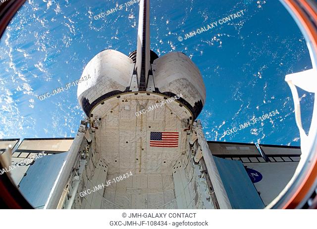 Space Shuttle Discovery (STS-120), docked to the International Space Station, is featured in this image captured by a crewmember onboard the station