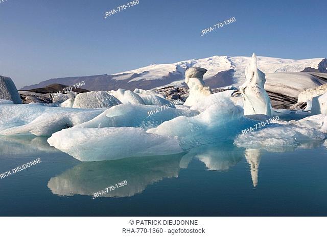 Icebergs in Jokulsarlon glacial lagoon, Oraefajokull glacier in the distance, East Iceland, Iceland, Polar Regions