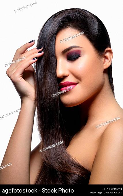 beautiful young woman with long healthy shiny hair. black color. copy space