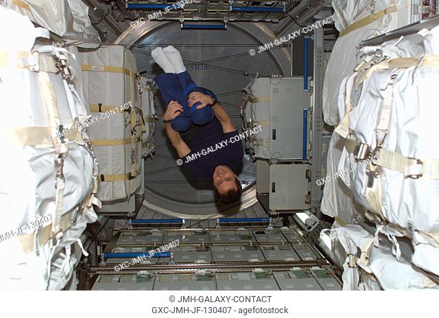Astronaut Daniel W. Bursch, Expedition Four flight engineer, floats in the Leonardo Multi-Purpose Logistics Module (MPLM)