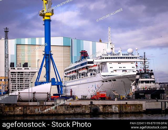 11 April 2022, Mecklenburg-Western Pomerania, Wismar: The cruise ship ""Superstar Libra"", which was last used as a residential ship for foreign shipyard...