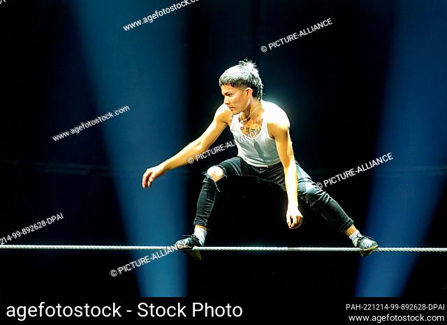 13 December 2022, North Rhine-Westphalia, Duisburg: An artist trains on the high wire at Circus Flic Flac for the premiere of the X-Mas show on Dec