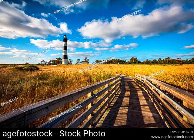 A sunny morning just after sunrise at Bodie Island Lighthouse near Nag's Head on the Outer Banks of North Carolina. The first iconic symbol along the Cape...