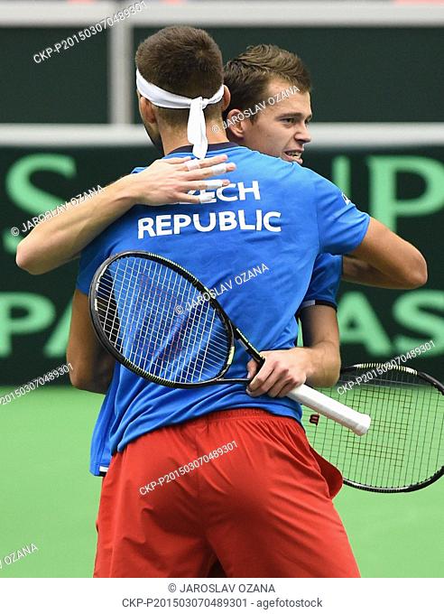 Adam Pavlasek (right) hugs his partner Jiri Vesely as they celebrate their victory at the Davis Cup World Group first round doubles tennis match against Samuel...
