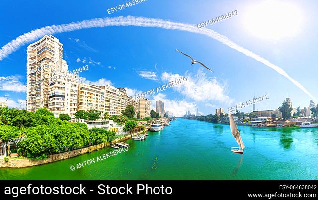 Beautiful Nile panorama with boats and typical live buildings of Cairo, Egypt