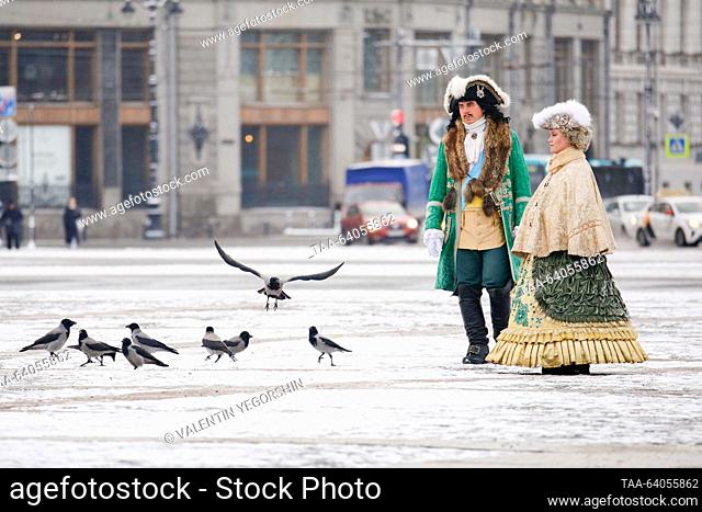 RUSSIA, ST PETERSBURG - OCTOBER 28, 2023: Street performers dressed as Emperor Peter the Great and Empress Catherine the Great of Russia are seen on Nevsky...