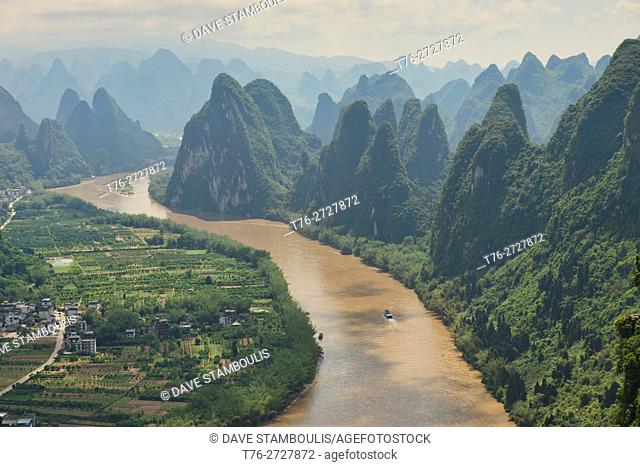 Boat traveling up the scenic Li River, Xingping, Guangxi Autonomous Region, China