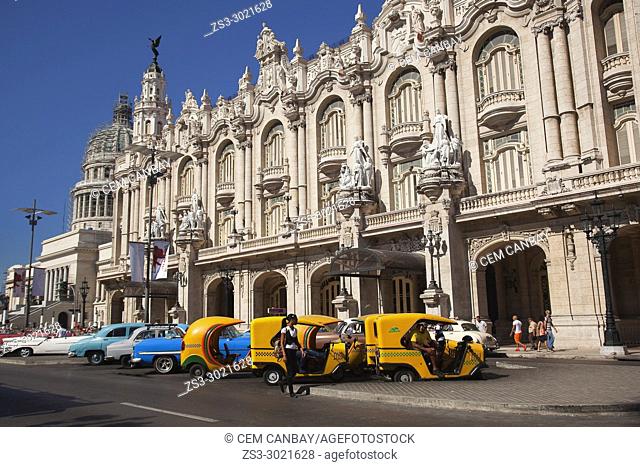 Coco taxis and old American cars in front of the colonial Great Theater-Gran Teatro at Center Havana, La Habana, Cuba, Central America