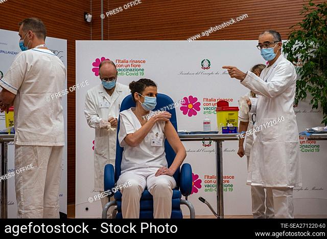 A handout photo made available by the Lazzaro Spallanzani National Institute for Infectious Diseases (INMI) shows healthcare workers waiting for their turn to...