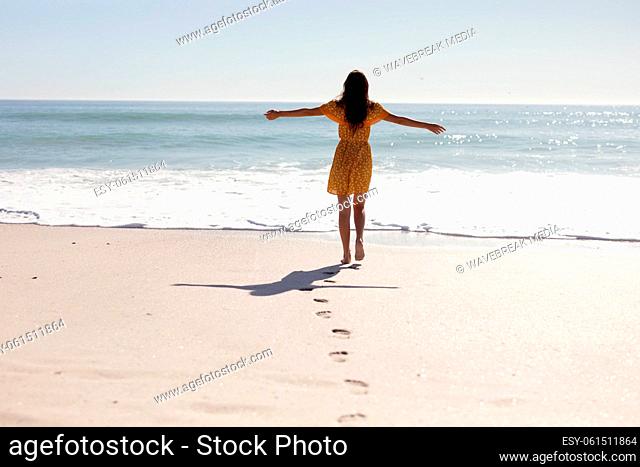 Caucasian woman standing on the beach