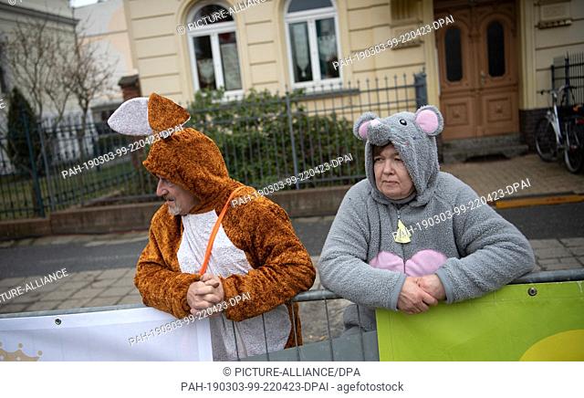 dpatop - 03 March 2019, Brandenburg, Cottbus: Carnivalists are waiting in Cottbus for the ""Train of Happy People"". The parade with more than 90 decorated...