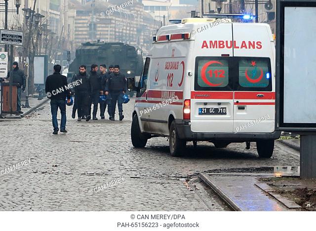 An ambulance and an army vehicle stand at the entrance to a cordoned-off area in the district of Sur in Diyarbakir, Turkey, 18 January 2016