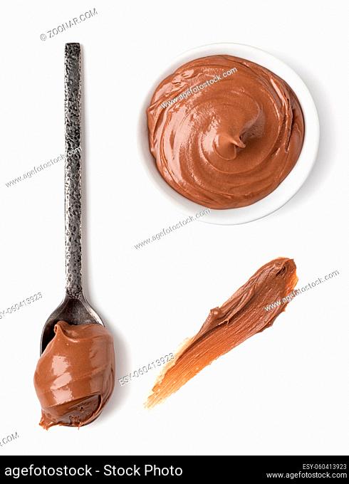 bowl and spoon with chocolate spread on white background isolated