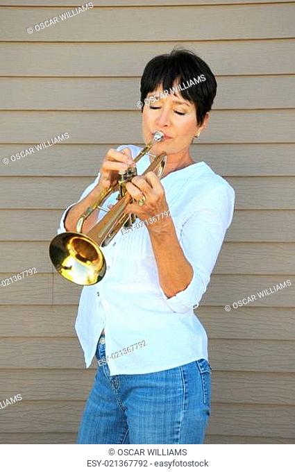 Mature female trumpet player