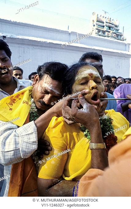 Piercing the iron rod- Mariamman festival at Coimbatore, Tamil Nadu, India