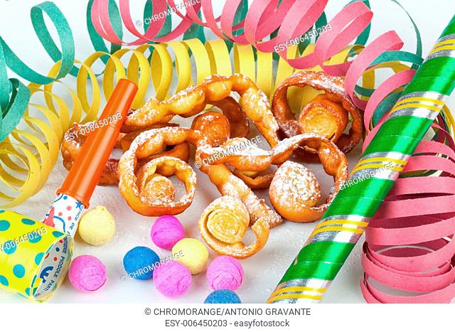 Typical Italian dessert for carnival, chiacchiere fries with toys and confetti