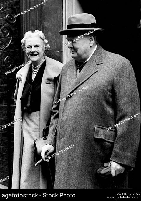 Premier Leaves For Holiday: Leaving No. 10, Downing Street this morning (Tuesday) for London airport are Mr. and Mrs. Winston Churchill