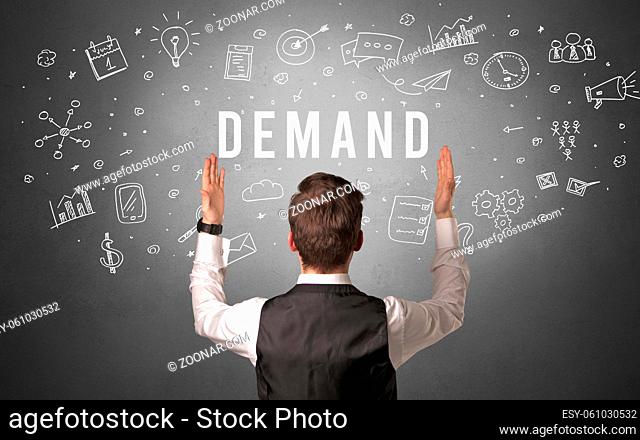 Rear view of a businessman with DEMAND inscription, modern business concept