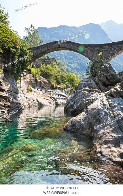 Switzerland, Ticino, Verzasca Valley, Verzasca river and historical Ponte dei Salti bridge