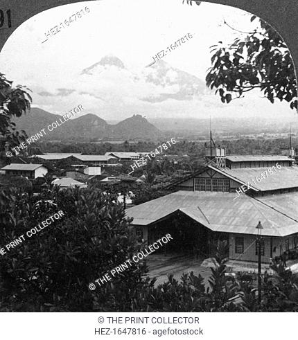 Escuintla, Guatemala, c1900s. In the distance can be seen the city's twin volcanoes, Fuego and Acatenango. Stereoscopic card. Detail