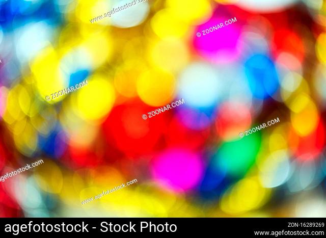 Blurred beautiful Happy New Year holiday decorations, colorful abstract blurry bokeh background effect. Out of focus glowing Christmas lights celebration...