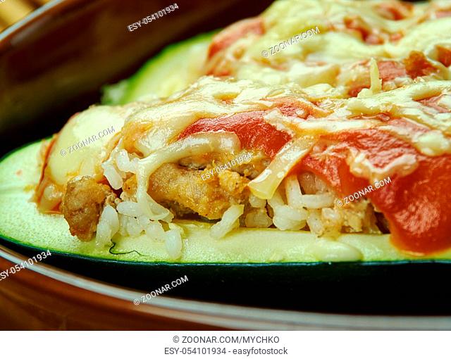 Beef Stuffed Zucchini Boats , Zucchini halves are filled with ground chicken and provolone cheese, then topped with Parmesan cheese