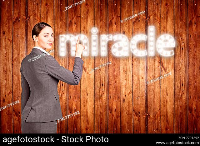 businesswoman touching singboard word over wood background