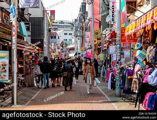 A picture of people walking in Takeshita Street, in Tokyo