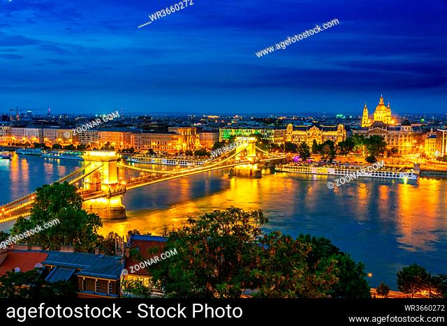 Panoramic view of Budapest with Hungarian Parliament Building on the bank of the Danube and Chain Bridge by night