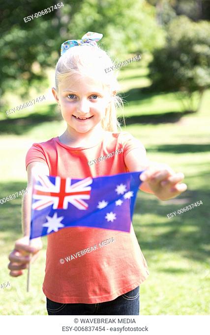 Little girl waving australian flag