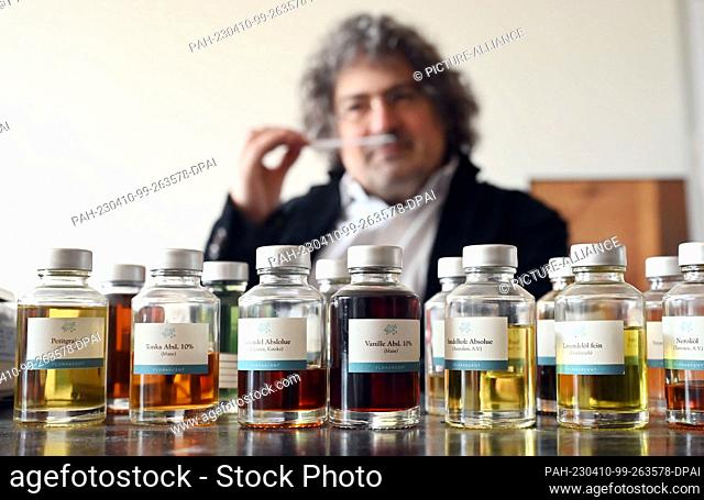 PRODUCTION - 03 April 2023, Baden-Württemberg, Karlsruhe: Perfumer Roland Tentunian takes a scent sample of a developed perfume recipe in his company...