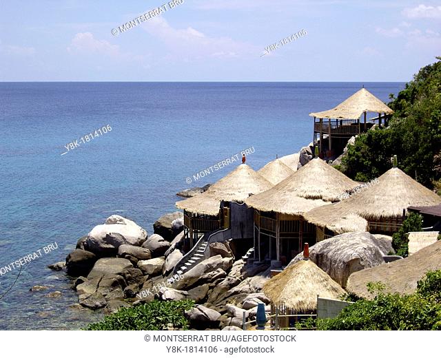 Thatch roof bungalows at tropical sea