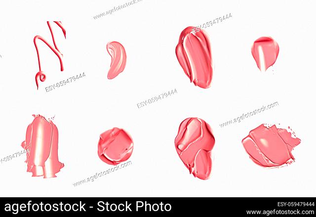 Coral beauty cosmetic texture isolated on white background, smudged makeup emulsion cream smear or foundation smudge, crushed cosmetics product and paint...